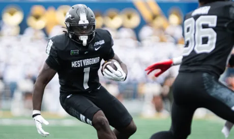 Arizona pounds WVU, 52-31